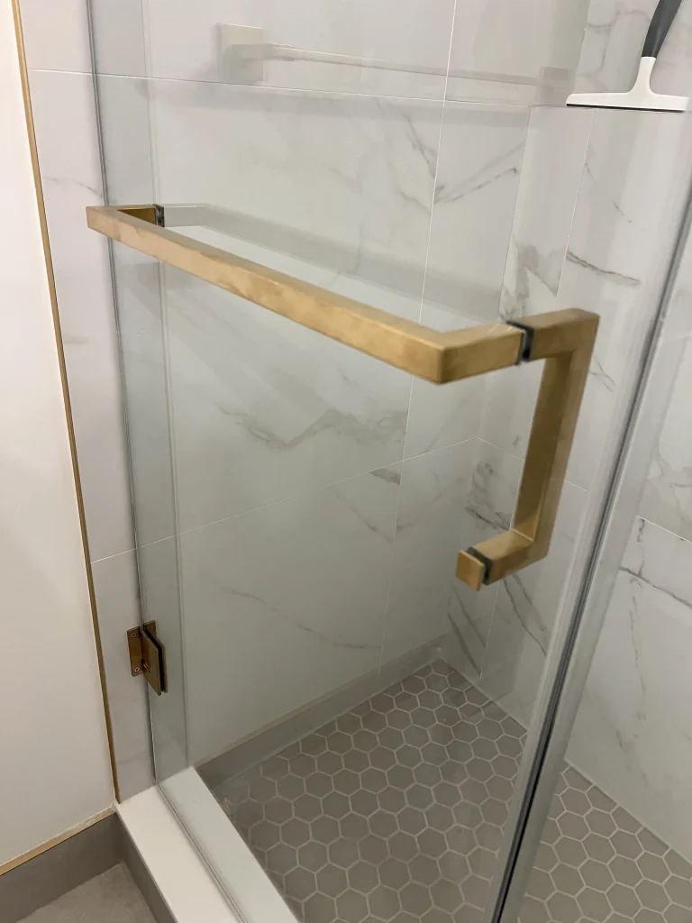 gold-hardware-on-frameless-shower Glass Shower Enclosures - 18